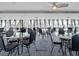 Dining room featuring glass tables and black chairs, providing an elegant space for meals and gatherings at 6009 Sea Ranch Dr # 203, Hudson, FL 34667