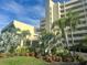 Well-manicured landscaping complements the condominium's exterior at 6009 Sea Ranch Dr # 203, Hudson, FL 34667