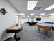 Game room area with billiards, chess table, and more at 6009 Sea Ranch Dr # 203, Hudson, FL 34667