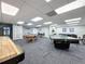 Game room area with shuffleboard, pool tables, ping pong table and seating area at 6009 Sea Ranch Dr # 203, Hudson, FL 34667