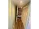 Hallway view featuring a glimpse into the bathroom and linen closet space at 6009 Sea Ranch Dr # 203, Hudson, FL 34667