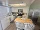 Bright kitchen features modern appliances and a breakfast bar island with extra seating at 6009 Sea Ranch Dr # 203, Hudson, FL 34667