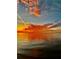 Incredible sunset view with brilliant orange and yellow hues reflecting on the tranquil water at 6009 Sea Ranch Dr # 203, Hudson, FL 34667
