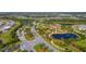 Aerial view of Del Webb community, showcasing lush landscaping, winding roads, and beautiful lakes at 17109 Kenton Ter, Bradenton, FL 34202