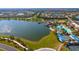 Aerial view of a lakefront community with a pool, restaurant, tennis courts and clubhouse at 17109 Kenton Ter, Bradenton, FL 34202