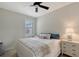 Cozy bedroom featuring a ceiling fan, natural light, and a comfortable bed with stylish bedding at 17109 Kenton Ter, Bradenton, FL 34202