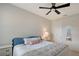 Bright bedroom with ceiling fan and window, offering a peaceful retreat and serene atmosphere at 17109 Kenton Ter, Bradenton, FL 34202