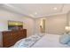 Well-lit bedroom with a TV and ensuite bathroom access for convenience and privacy at 17109 Kenton Ter, Bradenton, FL 34202