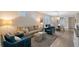 Open-concept living area with modern decor, hardwood floors, and ample natural light at 17109 Kenton Ter, Bradenton, FL 34202