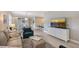 Spacious living room flowing into the dining area, featuring modern decor and natural light at 17109 Kenton Ter, Bradenton, FL 34202