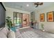 Comfortable sunroom with views of backyard, mini bar, and easy access to the house at 17109 Kenton Ter, Bradenton, FL 34202