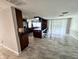 Modern kitchen featuring stainless steel appliances, a center island with bar seating, and tiled floors at 12215 Cobble Stone Dr, Hudson, FL 34667