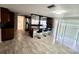 Spacious kitchen features stainless steel appliances, modern lighting, and breakfast bar with seating at 12215 Cobble Stone Dr, Hudson, FL 34667