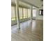 Enclosed sunroom featuring ceramic tile flooring and ample natural light at 12215 Cobble Stone Dr, Hudson, FL 34667