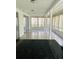 Enclosed porch area with large windows and plenty of natural light at 12215 Cobble Stone Dr, Hudson, FL 34667
