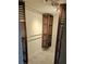 Spacious walk-in closet with custom wood shelving and plenty of storage space with overhead lighting at 12215 Cobble Stone Dr, Hudson, FL 34667