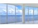 Living area with wall-to-wall windows showcasing scenic water views at 2900 Bay To Bay Blvd # 1502, Tampa, FL 33629