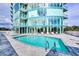 Inviting pool area with modern building in background at 2900 Bay To Bay Blvd # 1502, Tampa, FL 33629