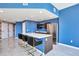 Modern kitchen with white countertops, dark wood cabinets, and gold barstools at 2900 Bay To Bay Blvd # 1502, Tampa, FL 33629