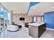 Modern kitchen with a white island, dark wood cabinets, and stainless steel appliances at 2900 Bay To Bay Blvd # 1502, Tampa, FL 33629