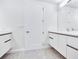 Modern bathroom with double vanity and white cabinets at 2900 Bay To Bay Blvd # 1502, Tampa, FL 33629