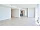 Open concept living room with kitchen island and light tile floors at 2900 Bay To Bay Blvd # 1502, Tampa, FL 33629