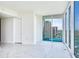 Light-filled living room showcasing a sliding glass door to a balcony at 2900 Bay To Bay Blvd # 1502, Tampa, FL 33629