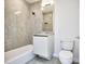 Modern bathroom with granite tile and floating vanity at 2900 Bay To Bay Blvd # 1502, Tampa, FL 33629