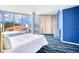 Bright bedroom with two twin beds, city views, and blue walls at 2900 Bay To Bay Blvd # 1502, Tampa, FL 33629