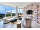 Sophisticated living room featuring a curved sofa, accent chairs, and a large TV at 2900 Bay To Bay Blvd # 1502, Tampa, FL 33629