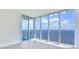 Living room with expansive windows offering stunning water views at 2900 Bay To Bay Blvd # 1502, Tampa, FL 33629