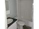Simple bathroom with a shower/tub combo and dark countertop at 2459 Ayerswood Dr, Brooksville, FL 34604