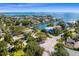 Stunning aerial view showcasing luxurious waterfront homes and lush landscaping in a serene coastal community at 2417 S Dundee St, Tampa, FL 33629