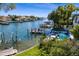 Breathtaking waterfront view with a pool and private dock, creating an ideal outdoor oasis for relaxation at 2417 S Dundee St, Tampa, FL 33629