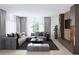 Spacious living room featuring a large sectional sofa and modern coffee table at 85 Davis Blvd # B, Tampa, FL 33606