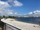 Sandy beach with picnic tables and water views at 85 Davis Blvd # B, Tampa, FL 33606