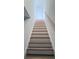 Modern staircase with light wood accents and white risers at 2608 E Clark St # 2, Tampa, FL 33605