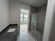 Contemporary bathroom with single vanity and walk-in shower at 1218 E Kay St # 27, Tampa, FL 33602