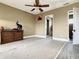 Large bedroom with dresser and access to bathroom at 935 Bayshore Dr, Palmetto, FL 34221