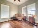 Bright bedroom with hardwood floors and a crib at 935 Bayshore Dr, Palmetto, FL 34221