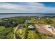 Aerial view of waterfront homes and properties, showcasing the community's serene landscape at 935 Bayshore Dr, Palmetto, FL 34221