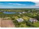 Waterfront property with two-story house and lush landscaping at 935 Bayshore Dr, Palmetto, FL 34221