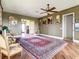 Spacious living room with hardwood floors, a large area rug, and ample natural light at 935 Bayshore Dr, Palmetto, FL 34221