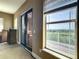 Bedroom with balcony access and window view at 935 Bayshore Dr, Palmetto, FL 34221