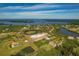Aerial perspective of coastal community featuring waterfront homes and natural scenery at 935 Bayshore Dr, Palmetto, FL 34221