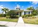 One-story home with a light green exterior and landscaping at 320 Ibisview Lane # 33572, Apollo Beach, FL 33572
