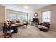 Comfortable living room featuring large windows and a TV at 320 Ibisview Lane # 33572, Apollo Beach, FL 33572