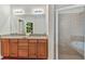 Double vanity bathroom with a large shower and garden tub at 320 Ibisview Lane # 33572, Apollo Beach, FL 33572