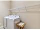 Laundry room with washer, dryer, and shelving at 320 Ibisview Lane # 33572, Apollo Beach, FL 33572