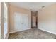 Bright bedroom featuring neutral walls, carpet, and double doors at 320 Ibisview Lane # 33572, Apollo Beach, FL 33572
